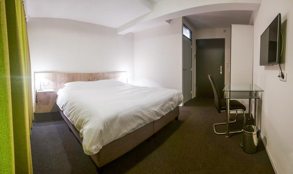 Hotel Taurus Cuijk Quarto foto